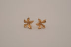 Gold tone flower stud earrings