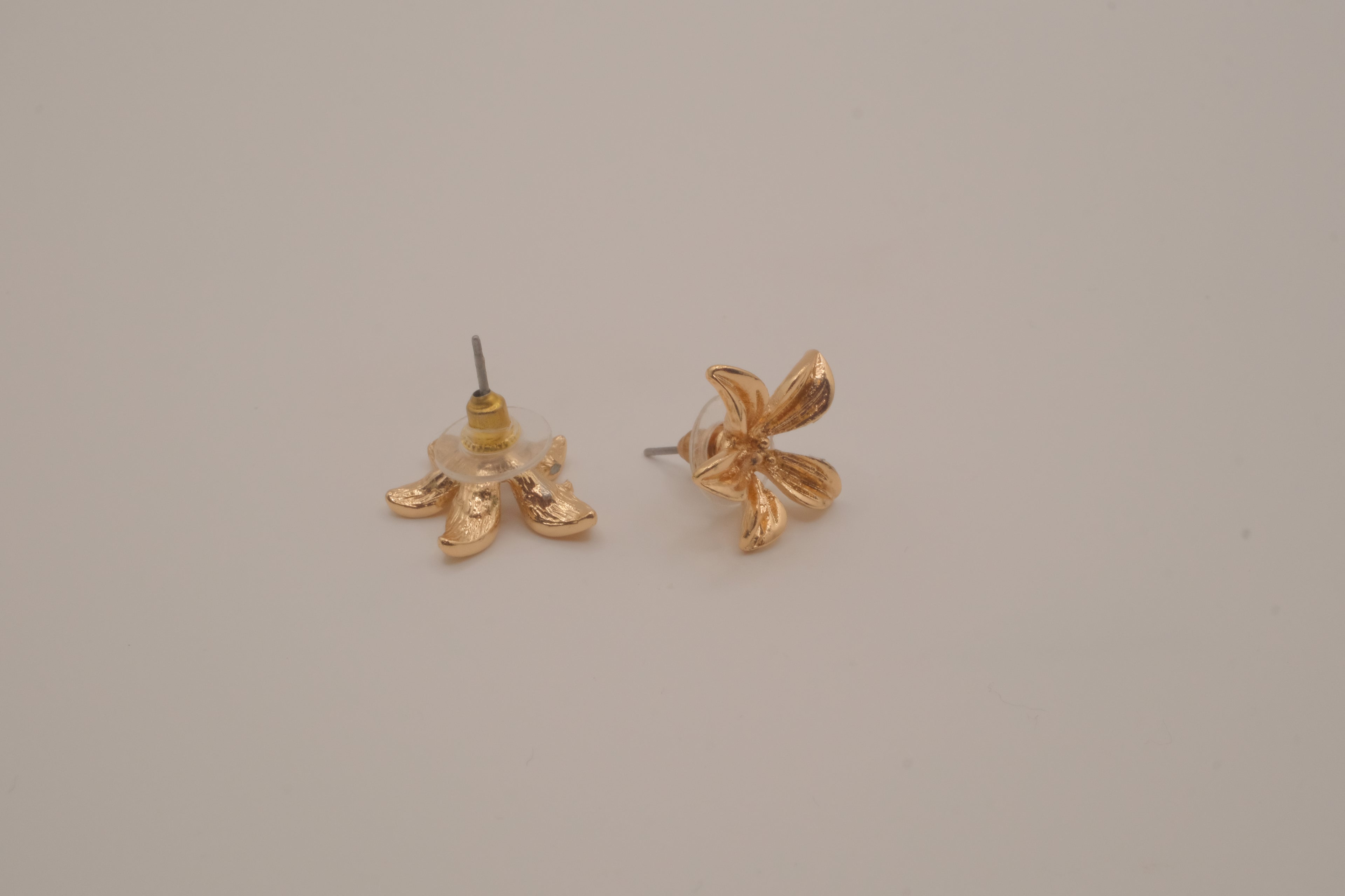 Gold tone flower stud earrings