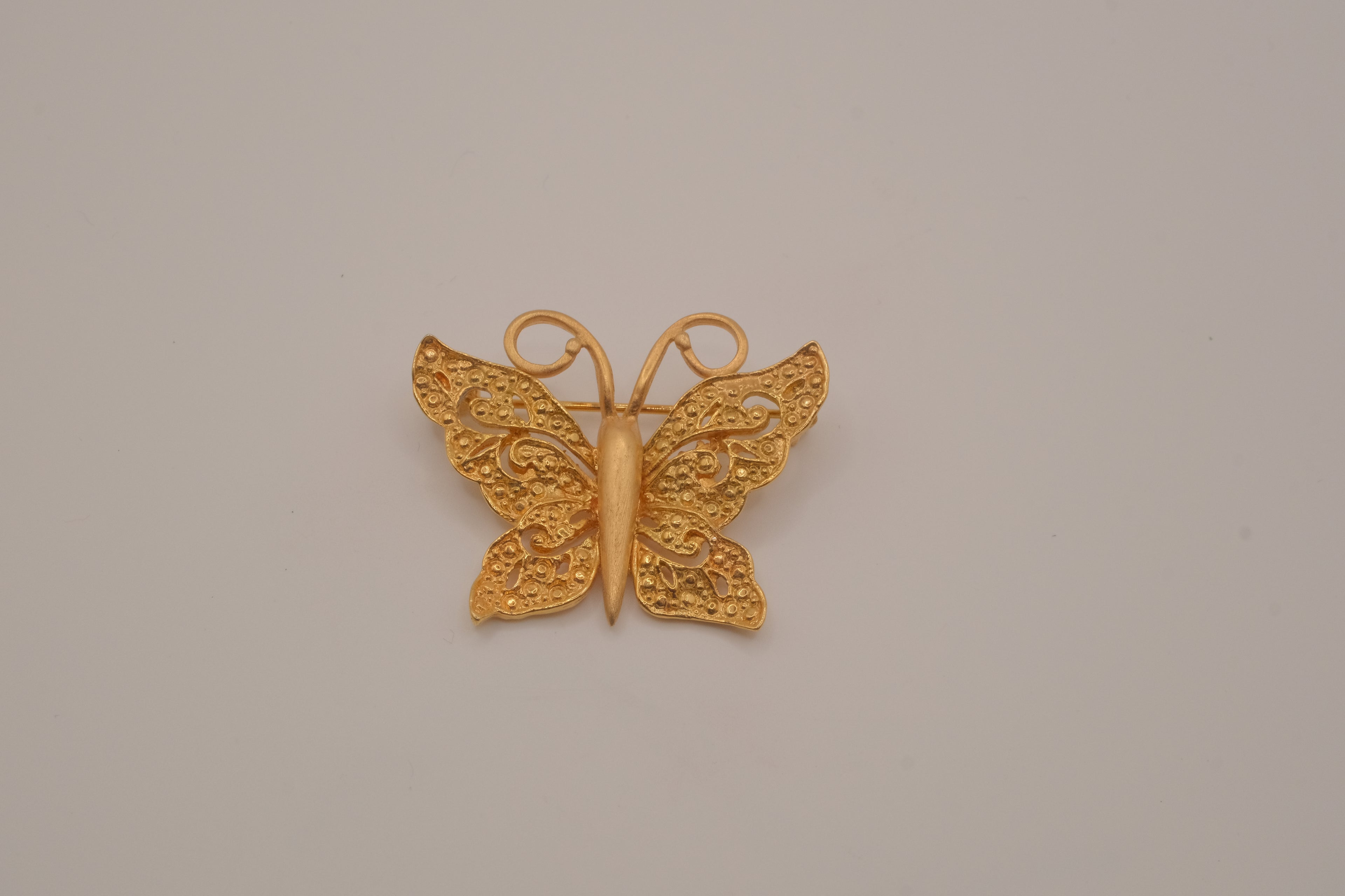 Vintage textured filigree butterfly brooch