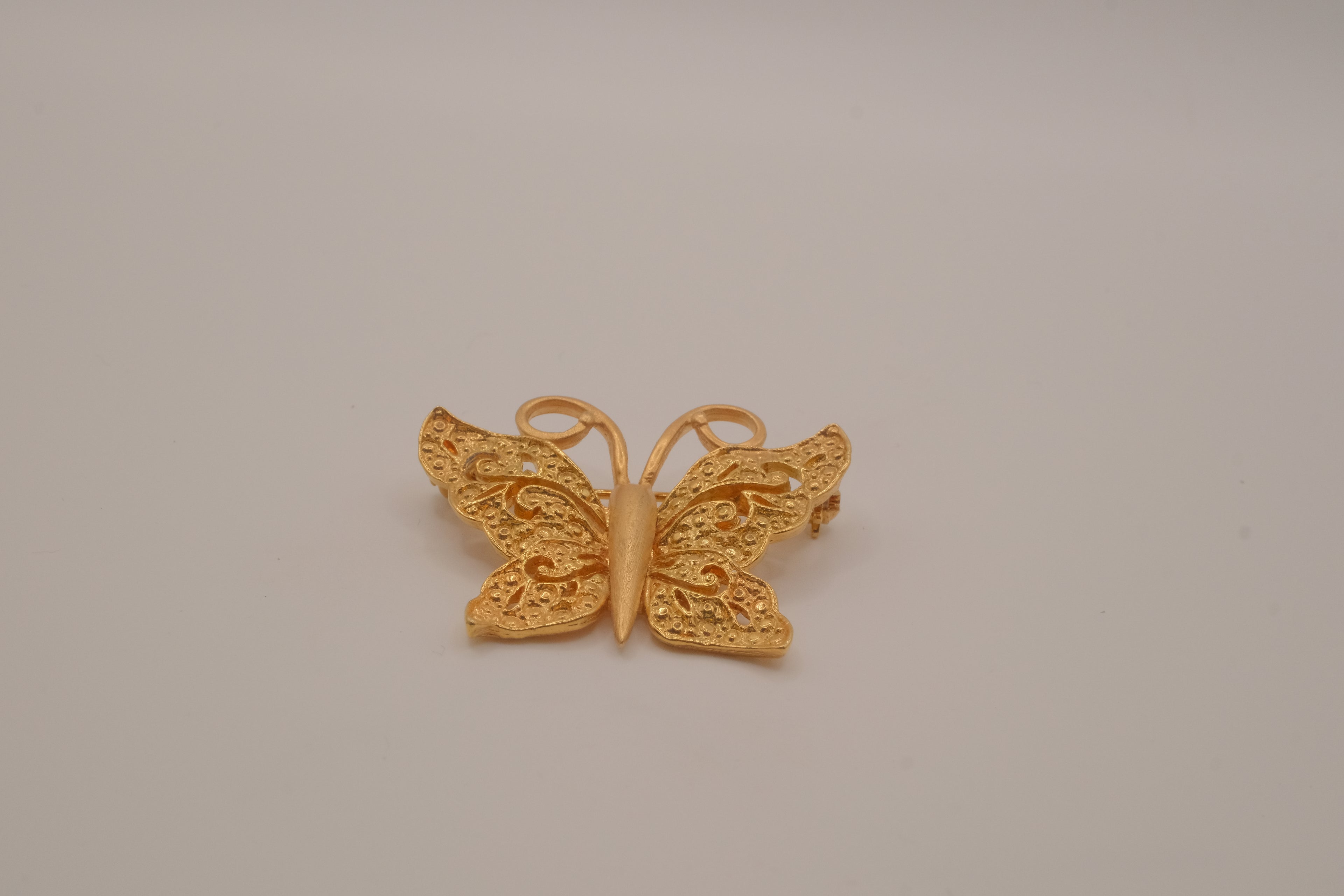 Vintage textured filigree butterfly brooch