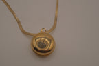 Antique round pocket watch-style locket