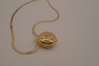 Antique round pocket watch-style locket