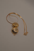 Antique round pocket watch-style locket