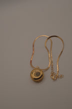 Antique round pocket watch-style locket