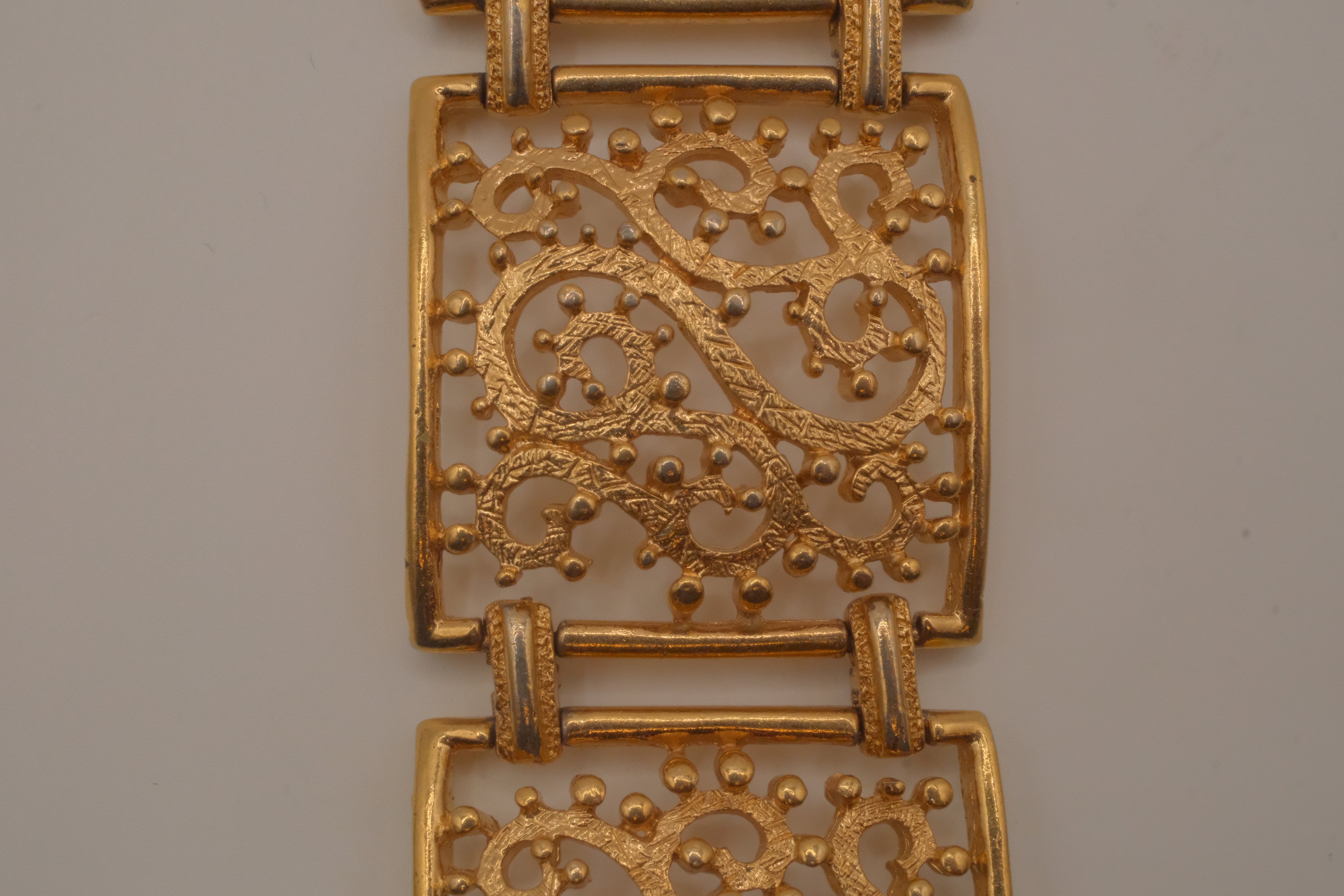 Vintage wide gold-tone openwork scroll panel link bracelet