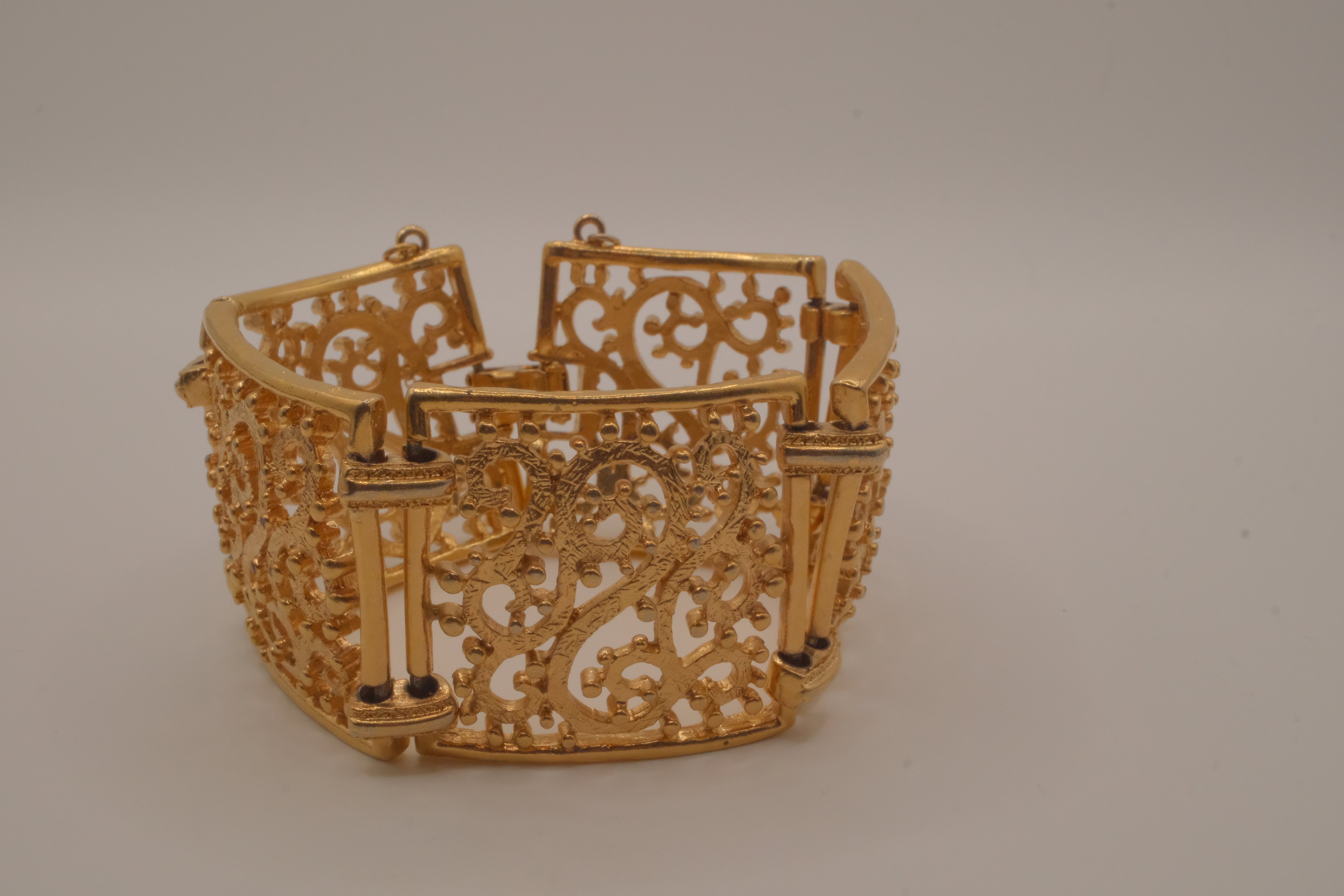 Vintage wide gold-tone openwork scroll panel link bracelet