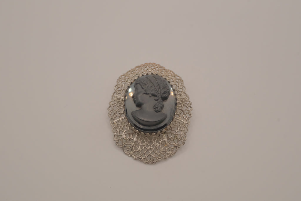 Vintage hematite glass cameo brooch