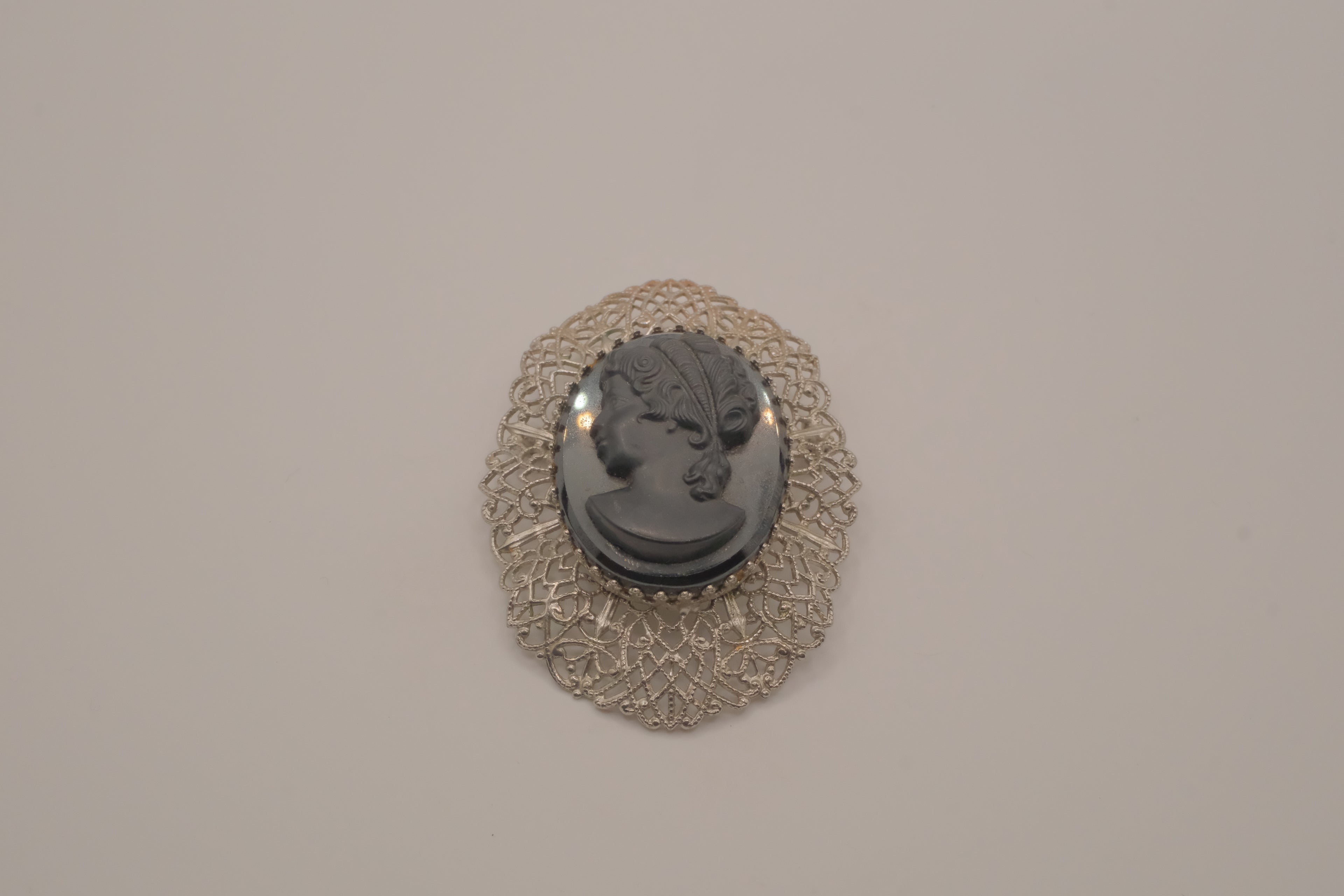 Vintage hematite glass cameo brooch