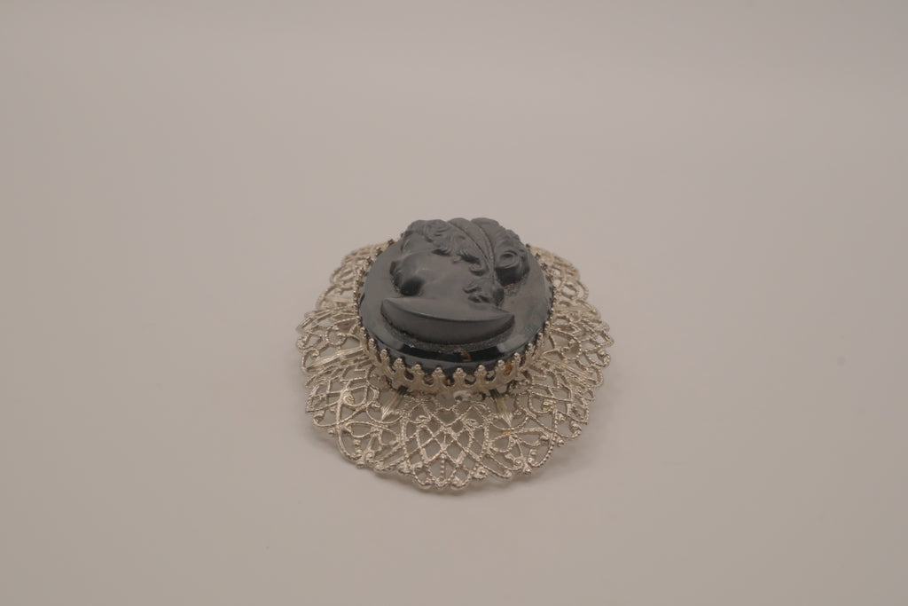 Vintage hematite glass cameo brooch