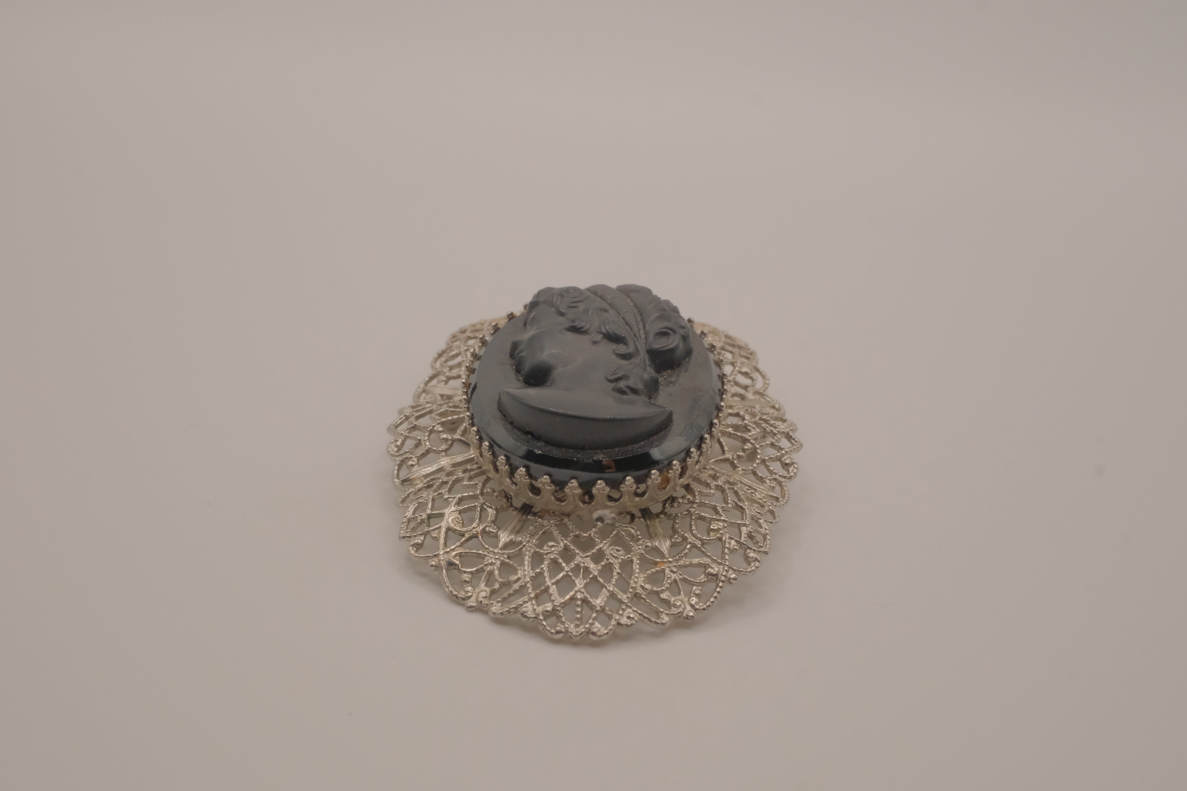 Vintage hematite glass cameo brooch