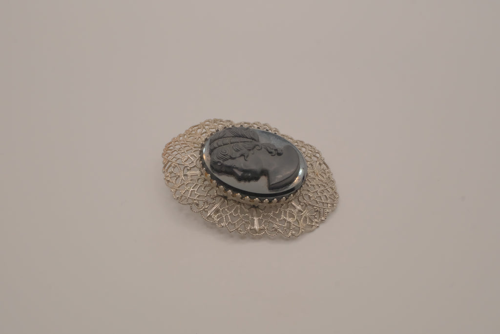 Vintage hematite glass cameo brooch