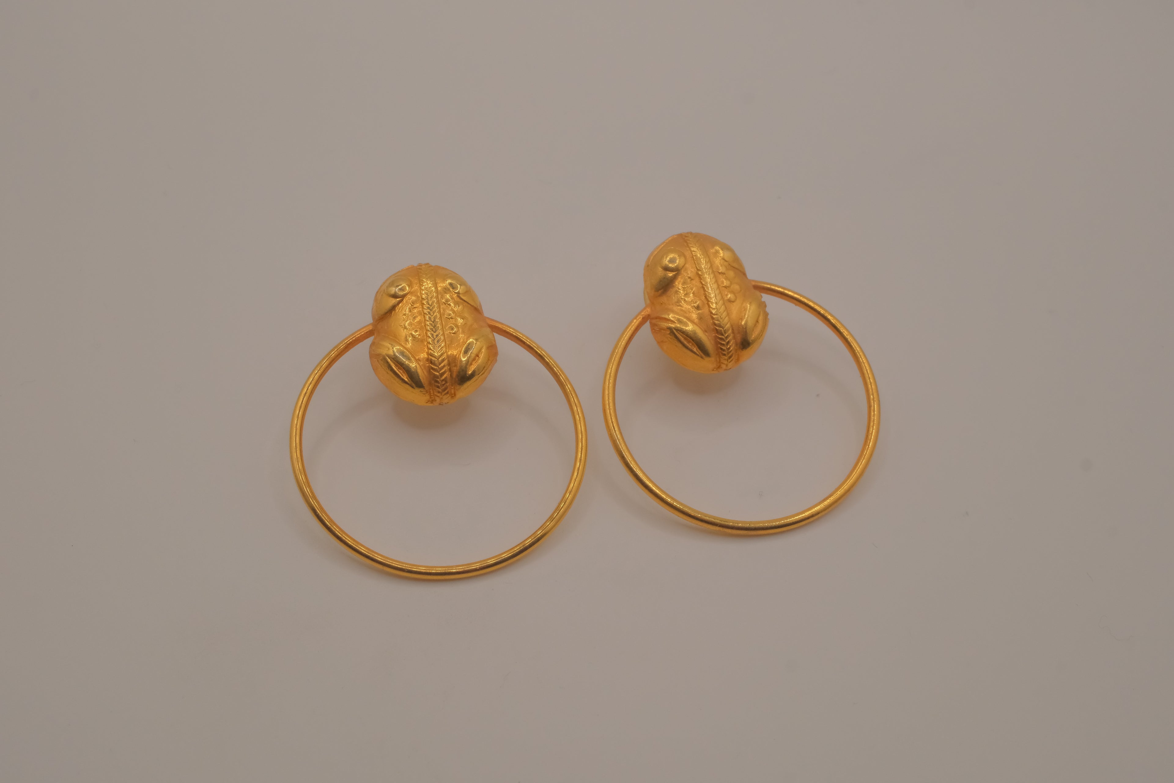 Artisanal gold hoop earring