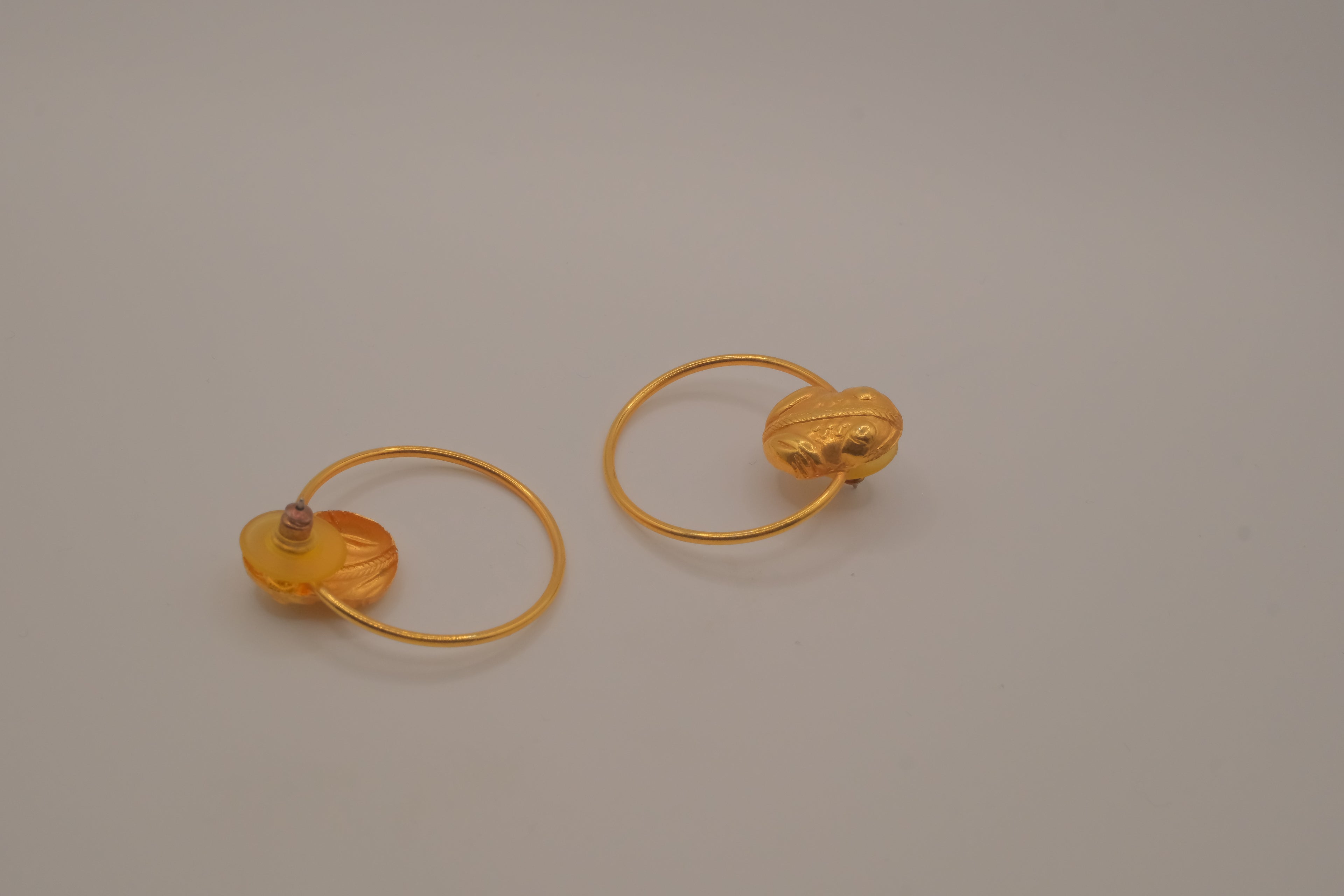 Artisanal gold hoop earring