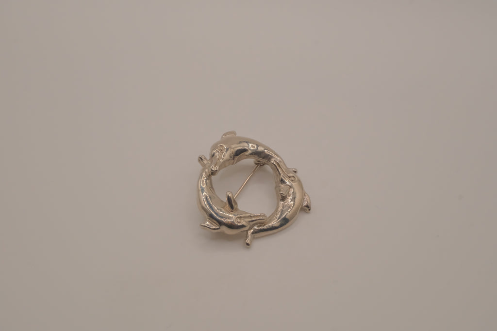 Vintage silver dolphin circle brooch