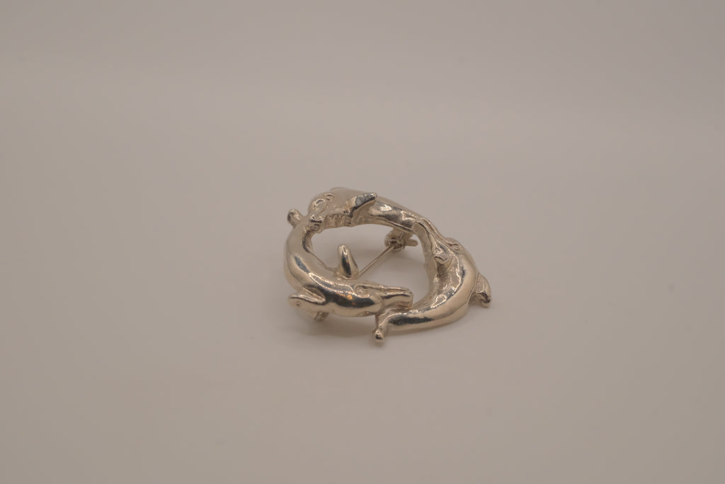 Vintage silver dolphin circle brooch