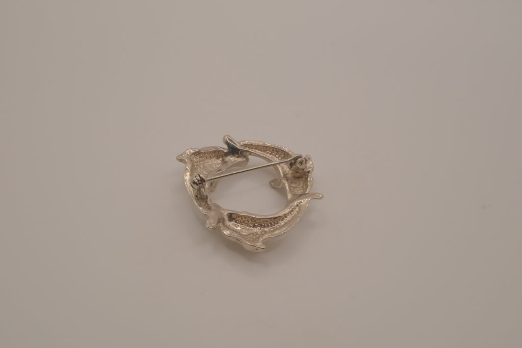 Vintage silver dolphin circle brooch